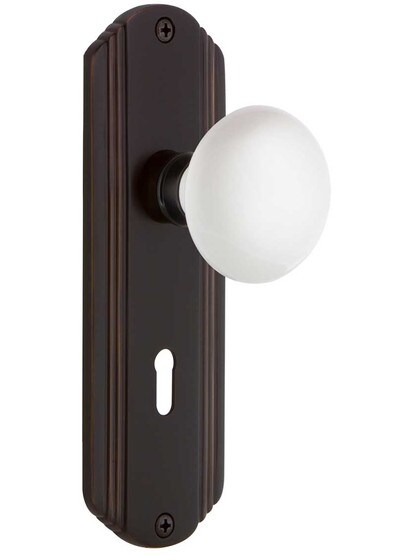 Streamline Moderne Mortise Lock Set With White Porcelain Door Knobs in Timeless Bronze.